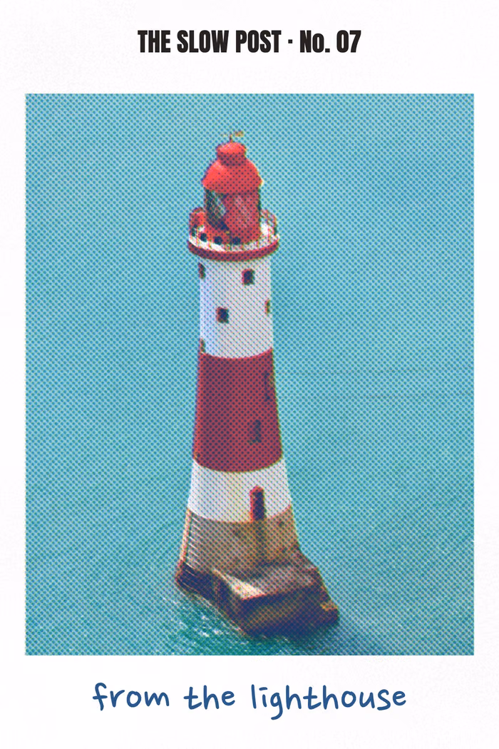 A postcard: a red and white lighthouse standing in a turquoise sea, printed in a few inks, "from the lighthouse" handwritten below