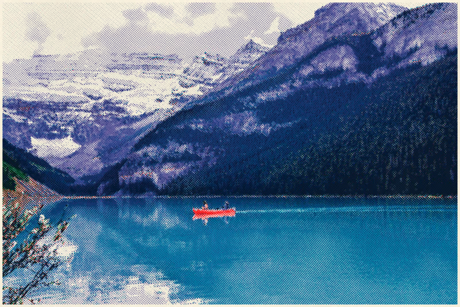A single red canoe on a turquoise mountain lake